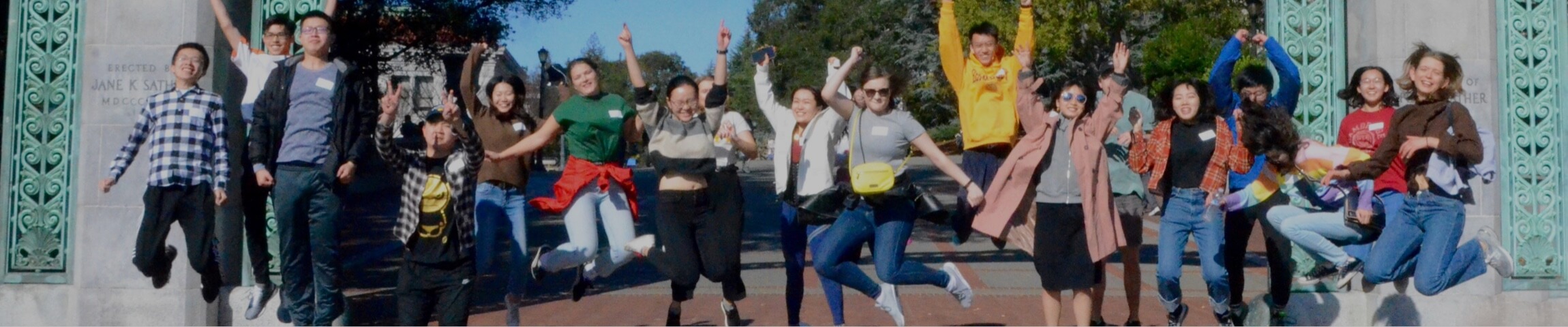 Photo of students jumping under Sather Gate