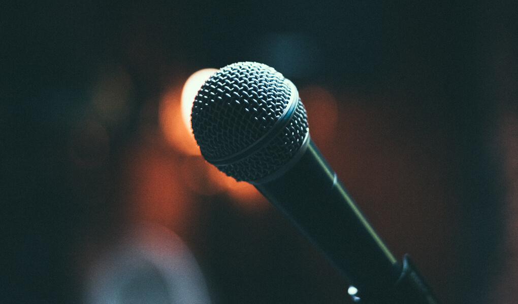 Photo of a microphone on a stage