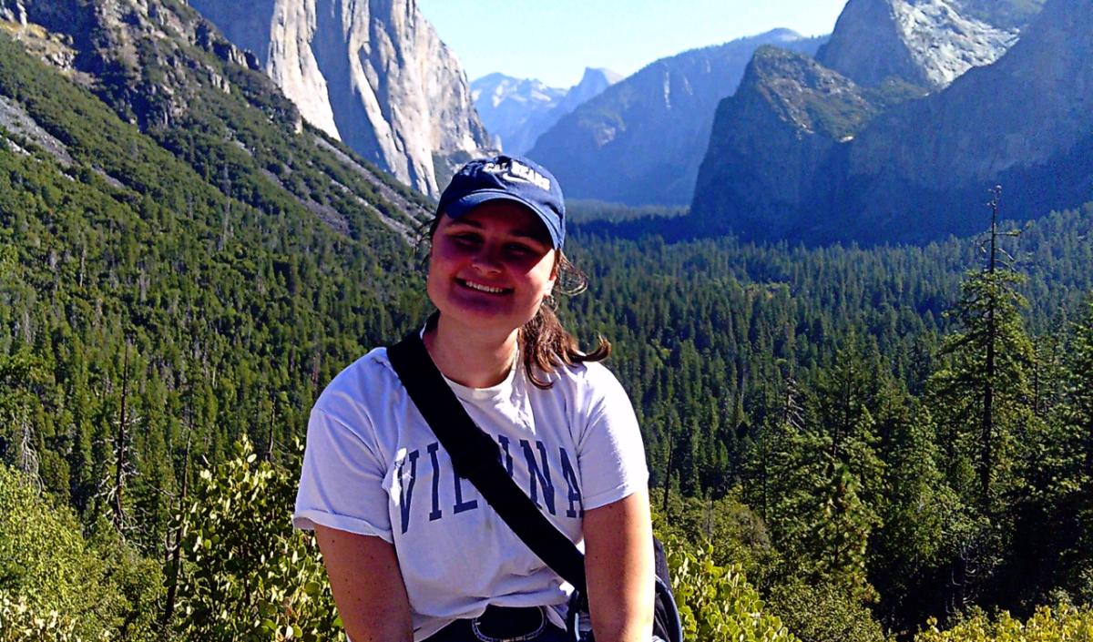 Ingrid with a hat on and mountains in the background