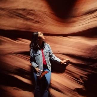 Photo of Elaine standing next to a desert canyon